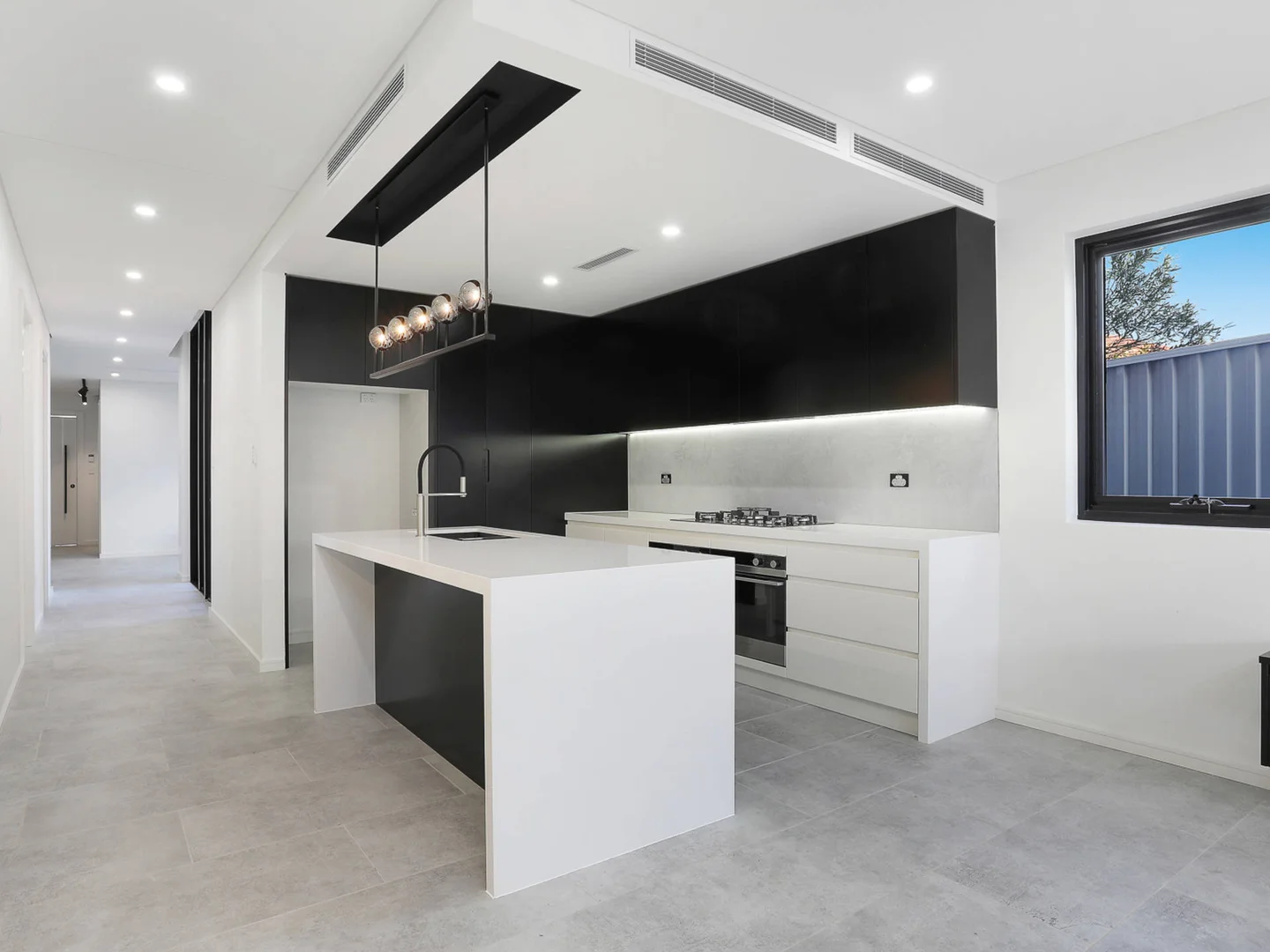 Monochrome Kitchen — Roselands Residence by Pier 8 Constructions